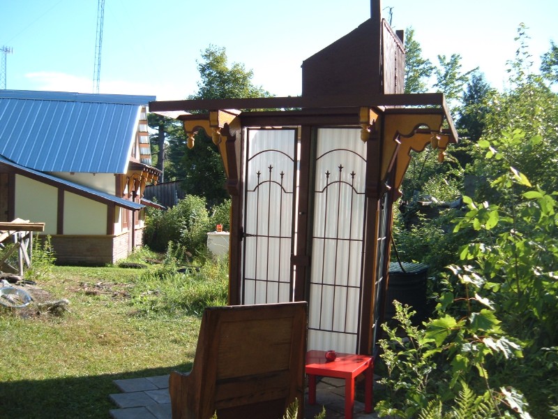 Stand alone solar shower entry side view